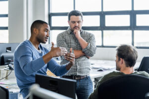 Businessmen discussing in creative office